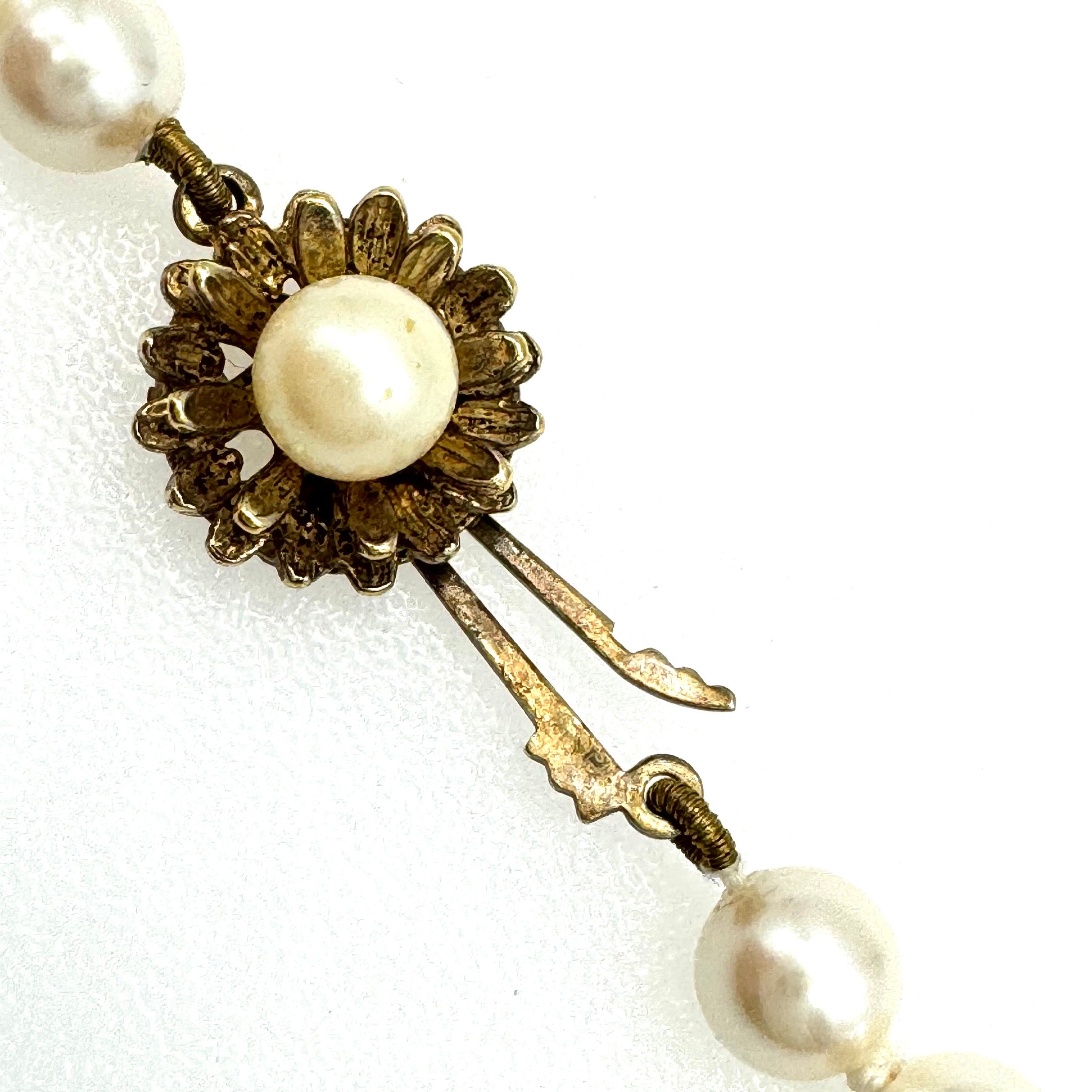 Vintage hand authentic knotted strand of pearls featuring large gold Vermeil clasp