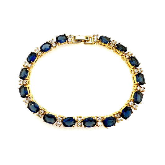 Bracelet à maillons plaqué or 18 carats bleu royal et cristal clair non signé